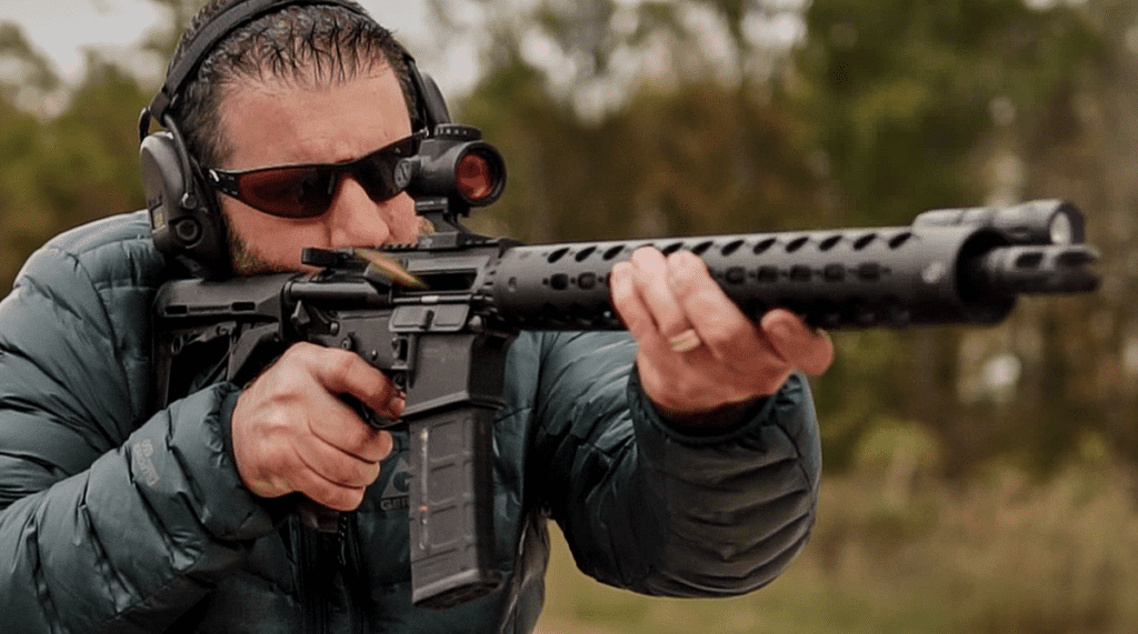 Shooting an AR-15 rifle with green tip 5.56 ammo at the range