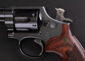 A revolver with a hammer that you can manually cock shown.